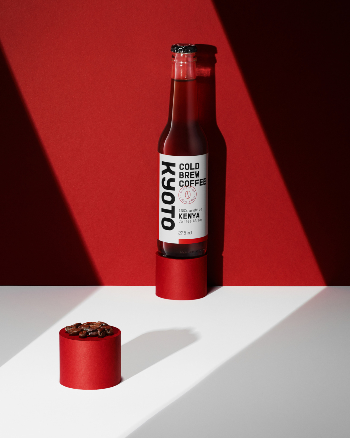 advertising photography of coffee drink in bottle on red backgroud