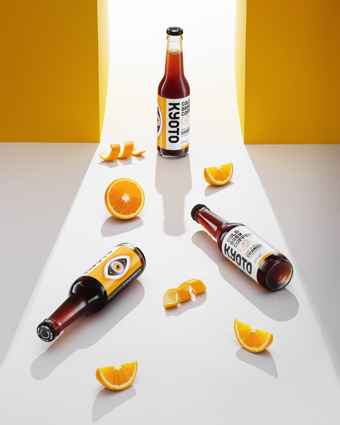 advertising photography of coffee drink in bottle on orange backgroud