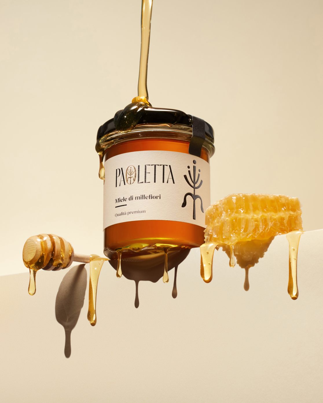 product photography of honey jar and honeycomb